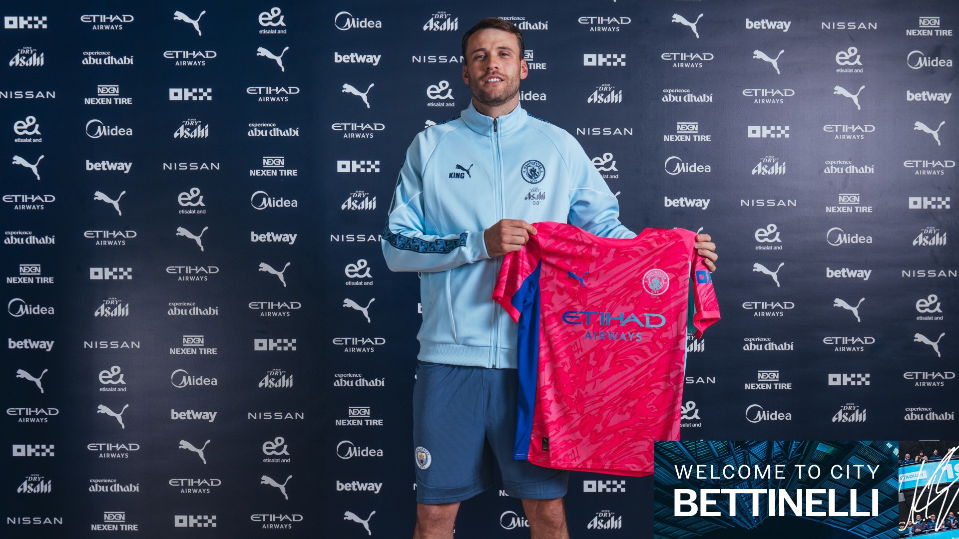 bettinelli-holds-shirt.jpg